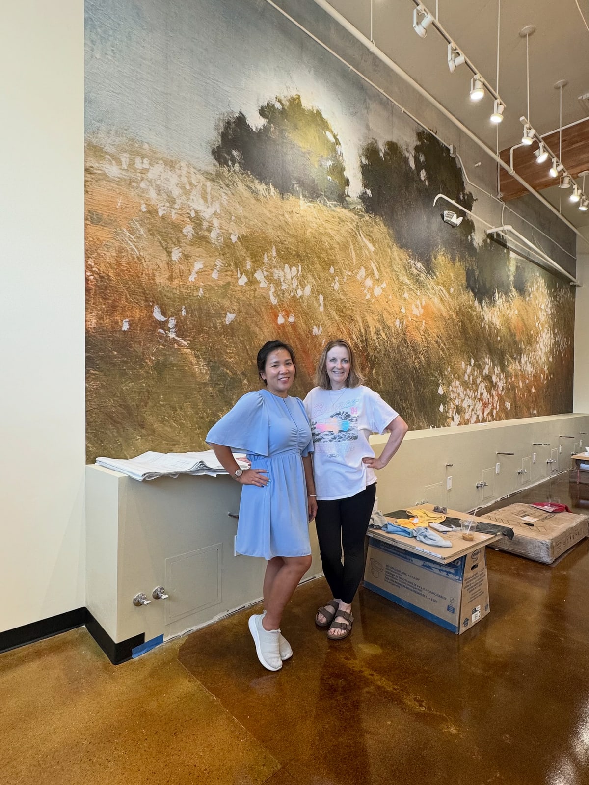Wendy of Bellavi Day Spa with a colleague inside a salon during buildout
